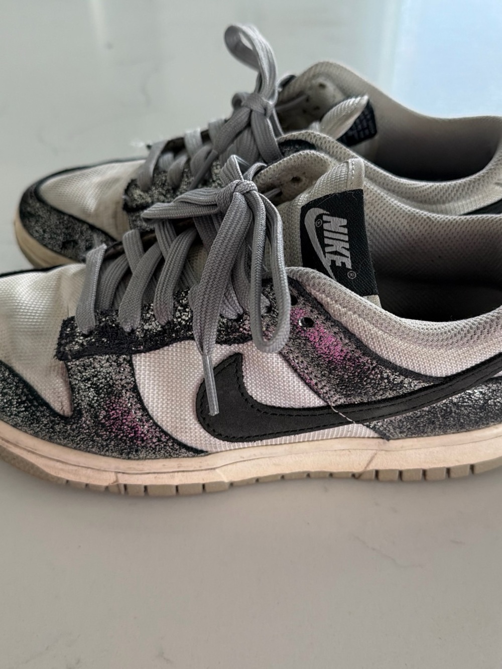 Nike Women’s White and Gray Low-Top Sneakers with Black Swoosh and Pink Speckle